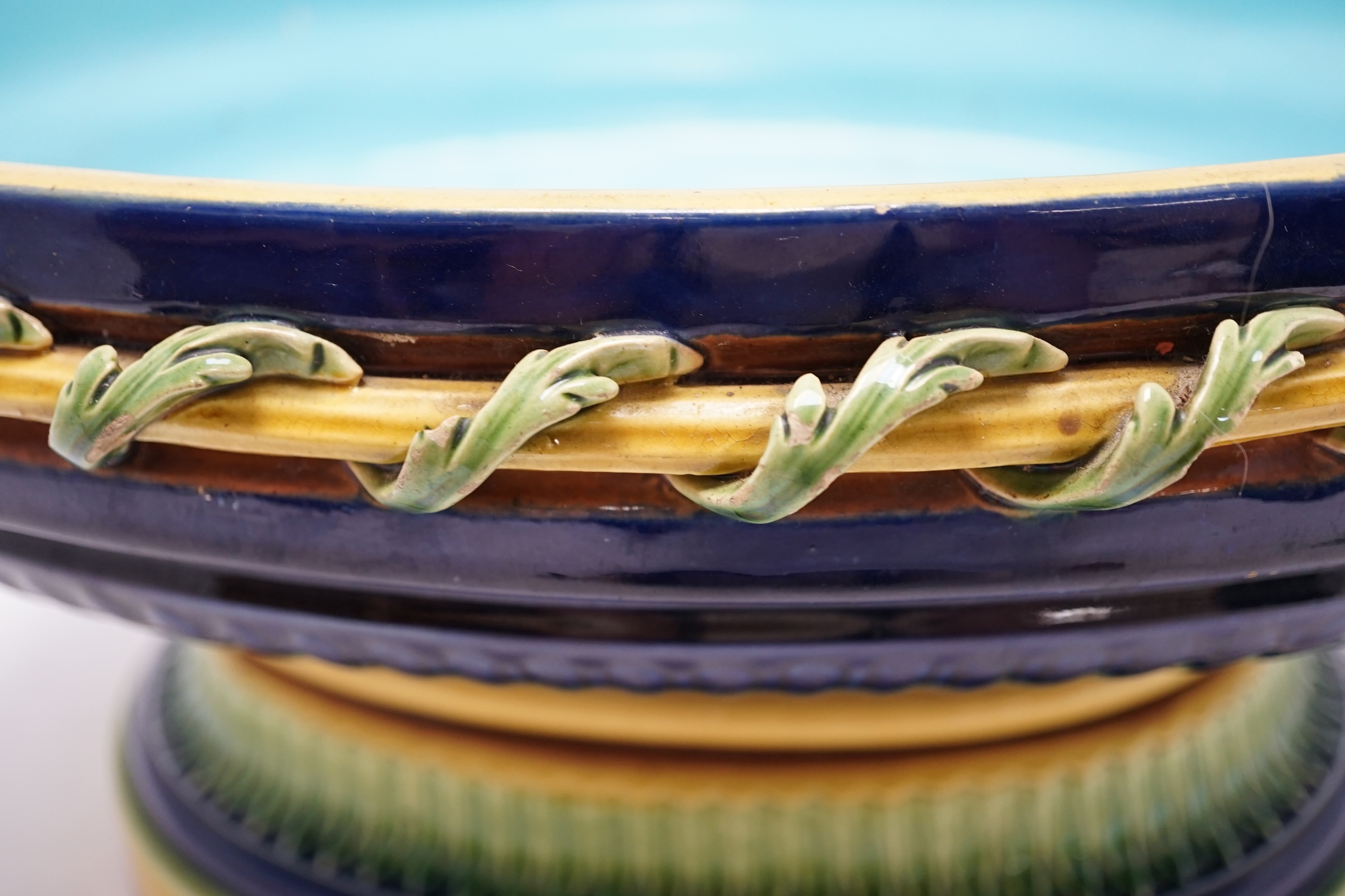 A Minton majolica cheese dome, and a large majolica pedestal tureen, 42cm wide. Condition - fair